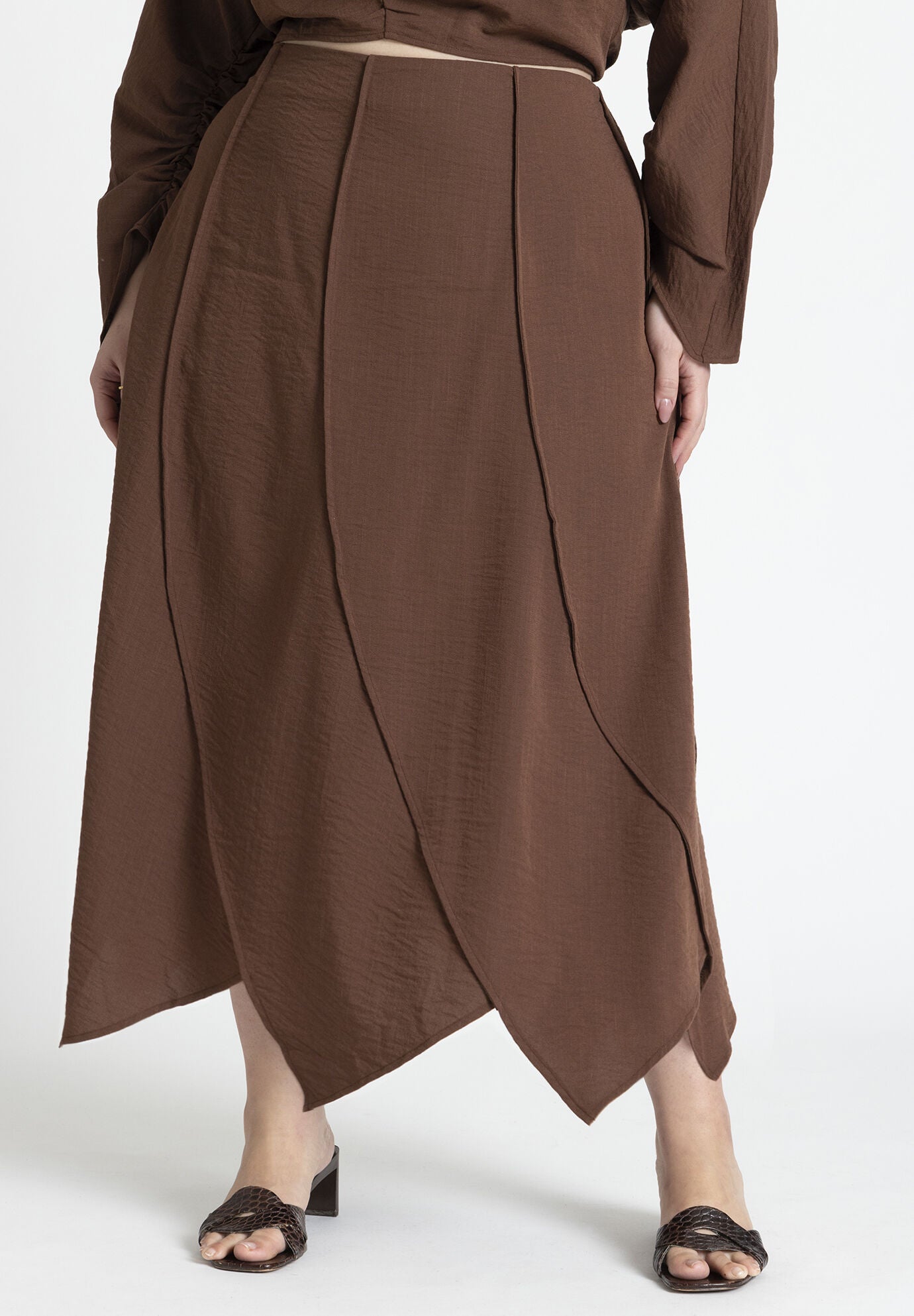 A seam-detail skirt in rich, earthy tones, symbolizing the intersection of craftsmanship and the sacred in 2026 art.